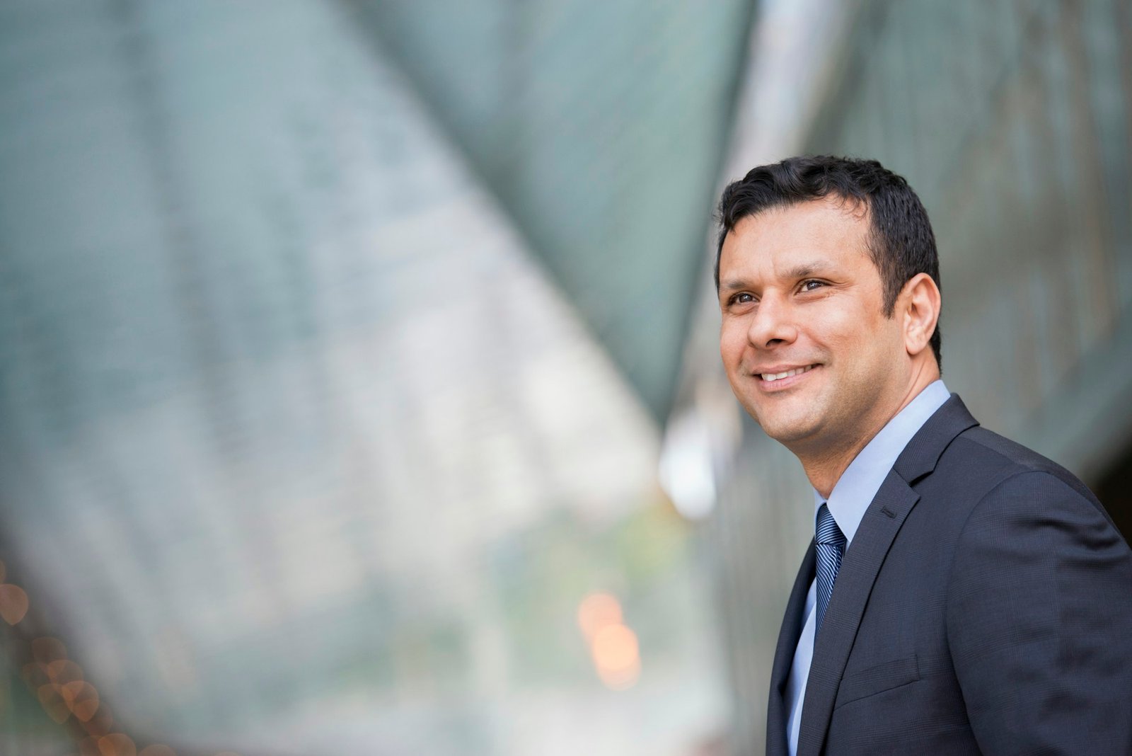 A latino businessman in business clothes.