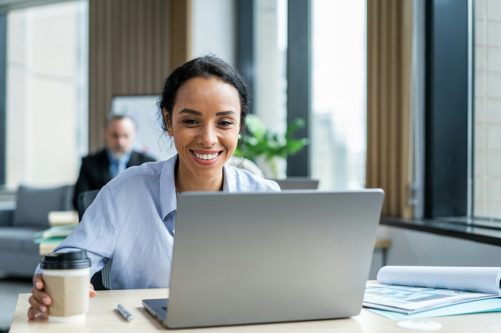 Latino beautiful businesswoman using laptop computer working in office.